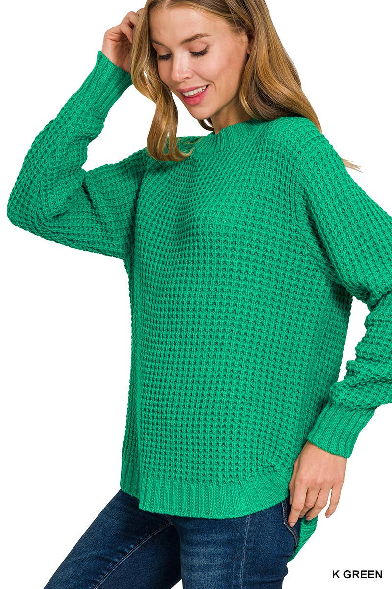 Woman wearing a green sweater on a white background